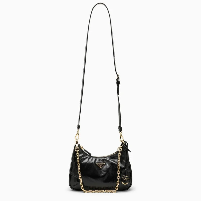 Prada Cleo bags with a contrast - colored interior for visual interestPrada Re-Edition 2005 Black Patent Leather Bag Women