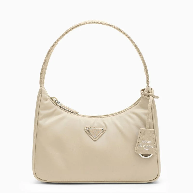 Ladies Prada Re - Edizione 2005 bags in a pastel color for a soft lookPrada Beige Re-Edition 2000 Mini Handbag Women