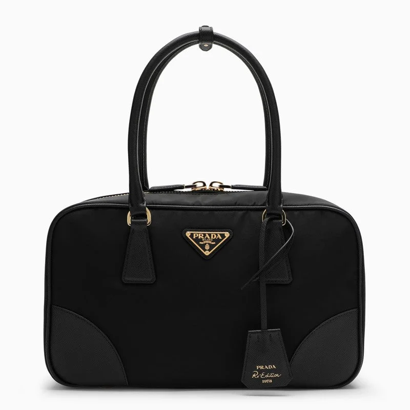 Prada Cahier bags with a monogram - embossed leather surfacePrada Re-Edition 1978 Re-Nylon And Saffiano Medium Black Top Case Women