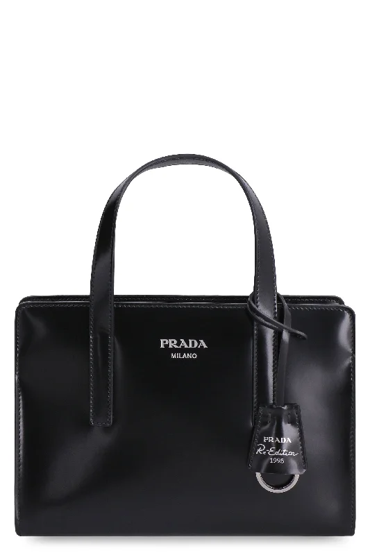 Prada Cahier bags with a monogram - embossed leather surfacePRADA RE-EDITION 1995 MINI HANDBAG