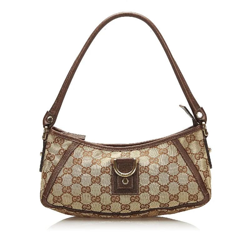 Women Gucci Sylvie bags with a monogram - embossed leatherGucci Abbey GG Canvas Baguette